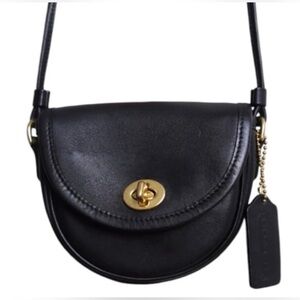 Coach Black vintage mini
Watson Crossbody Bag with Gold Accents